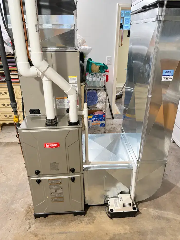 A Bryant furnace connected to newly fabricated sheet-metal plenum ductwork