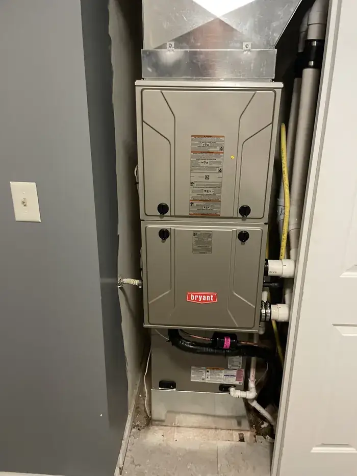 A Bryant furnace installed in a utility closet